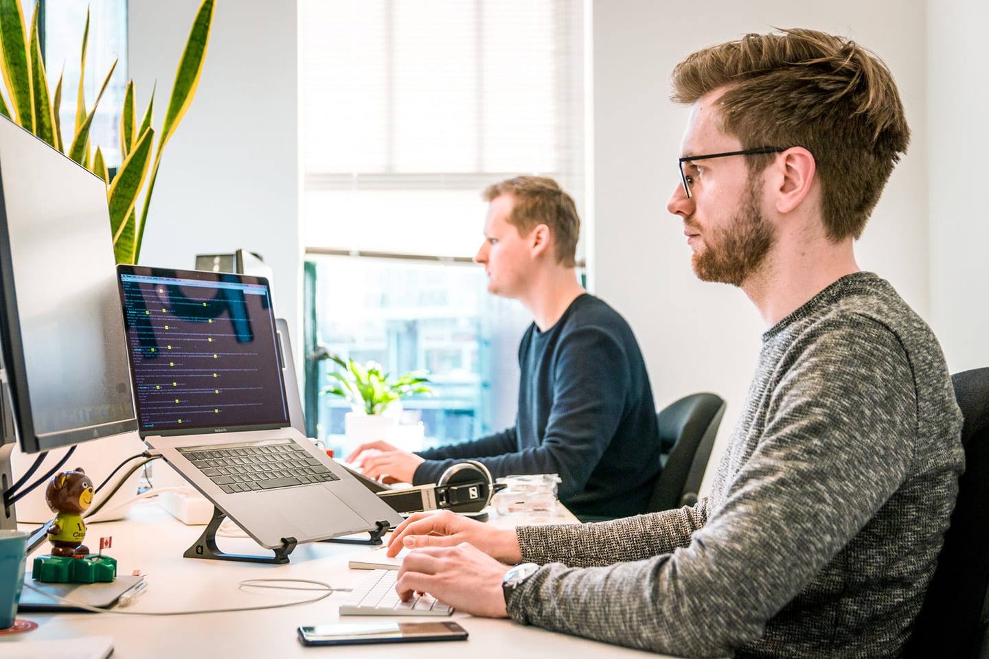 Two people working together on a performance audit
