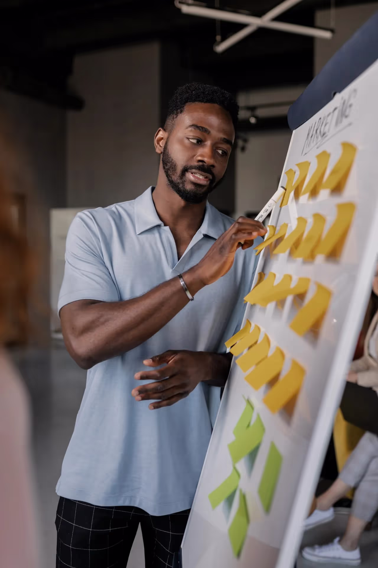 Strategist mapping a campaign on a whiteboard